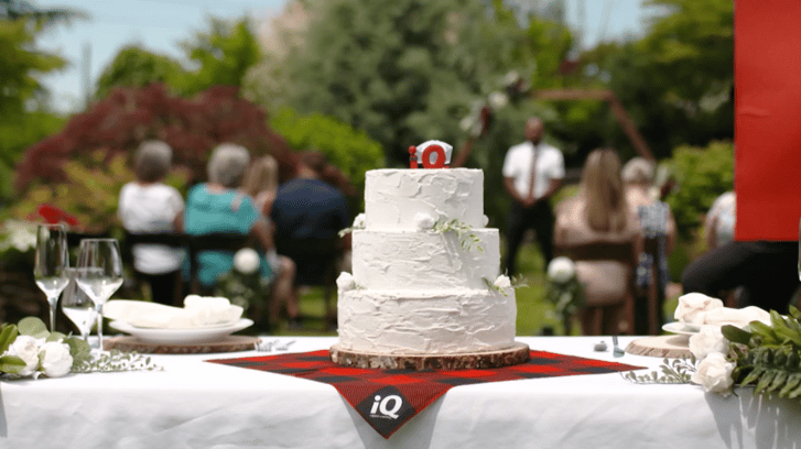 wedding cake on table with iQ Credit Union tablecloth
