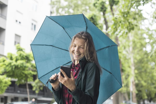 Woman outside holding an umbrella