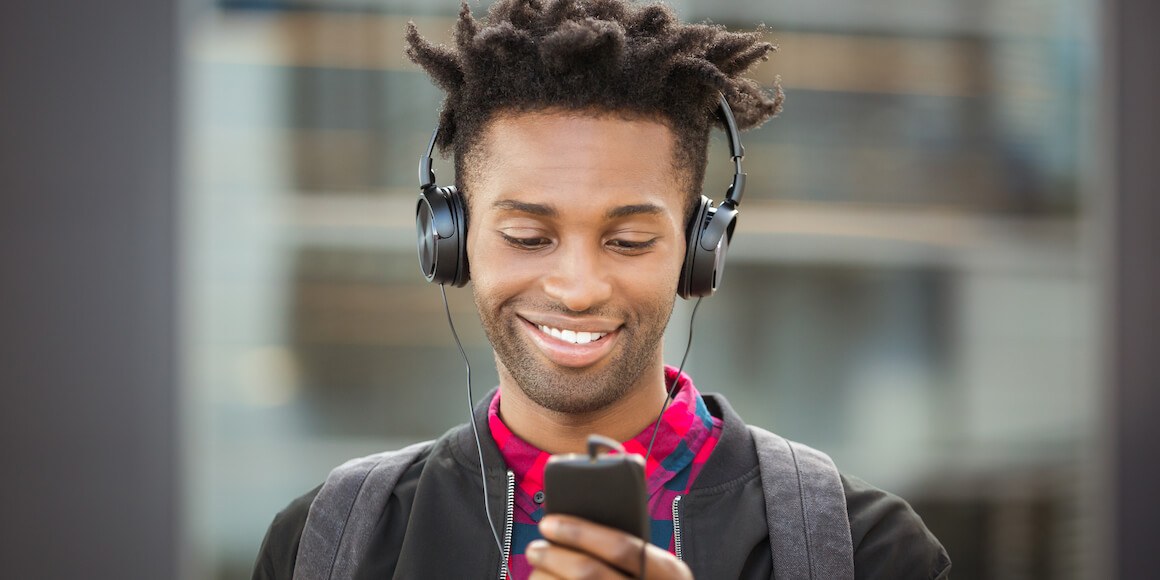 College aged student listening to music. 